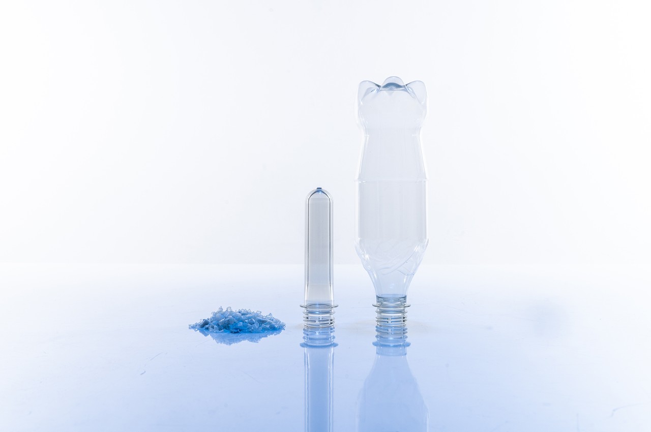 rPET flakes are used to make PET preforms that are inflated into bottles.